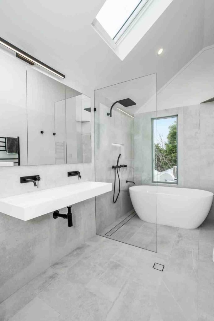 bathroom renovation installation 2 Expert plumber Cork team renovating a modern bathroom with stylish fittings and quality tiling in Cork City.